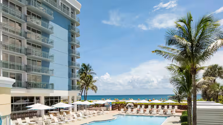 Luxury poolside view at The Singer Oceanfront Resort in Palm Beach, Florida